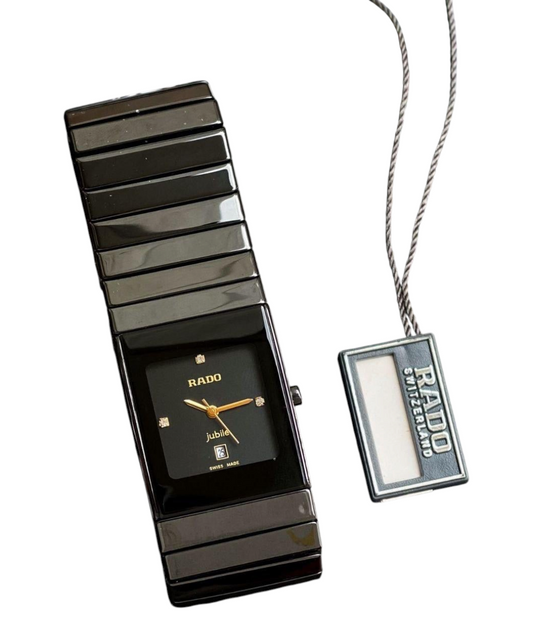 ACCHA TIME Rado Men In Black watch with a high-tech black ceramic band, square dial, and gold-tone hands.