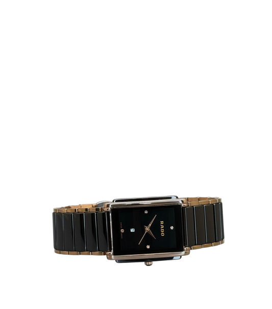 ACCHA TIME rectangular watch with black dial, diamond markers, and two-tone ceramic and gold-tone stainless bracelet.